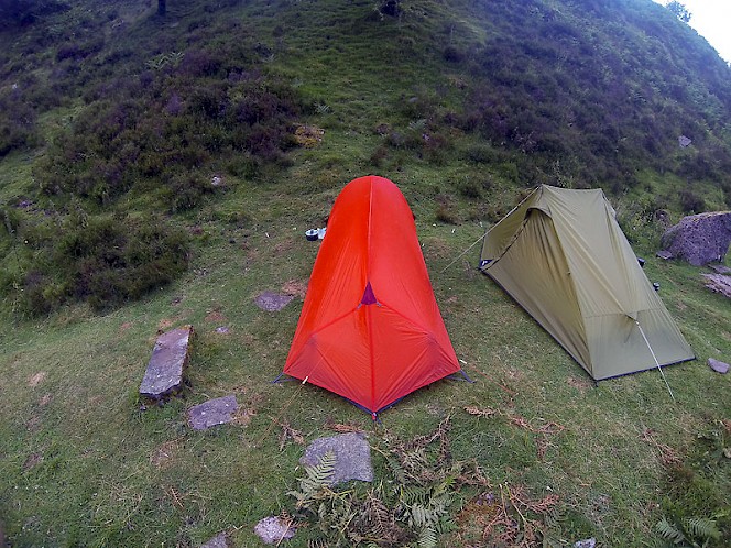Rear view of the Vaude Hogan UL Argon pitched next to the Mountain Equipment AR Ultralight 2. Note the enforced sides giving more space in the foot end.